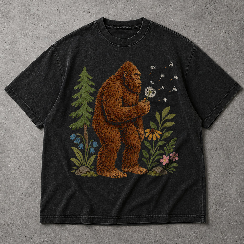SF_COLOR=black; SF_ITEM=adult-t-shirt; SF_ROLE=main; Funny Bigfoot Blowing A Dandelion T-Shirt Retro Floral Sasquatch Outdoors Tee - Black Adult T-Shirt product image
