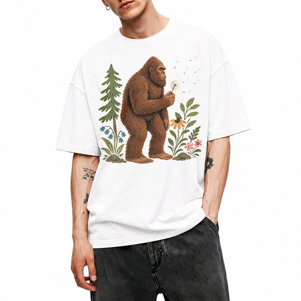 SF_COLOR=white; SF_ITEM=adult-t-shirt; SF_ROLE=gallery; Funny Bigfoot Blowing A Dandelion T-Shirt Retro Floral Sasquatch Outdoors Tee - White Adult T-Shirt product image