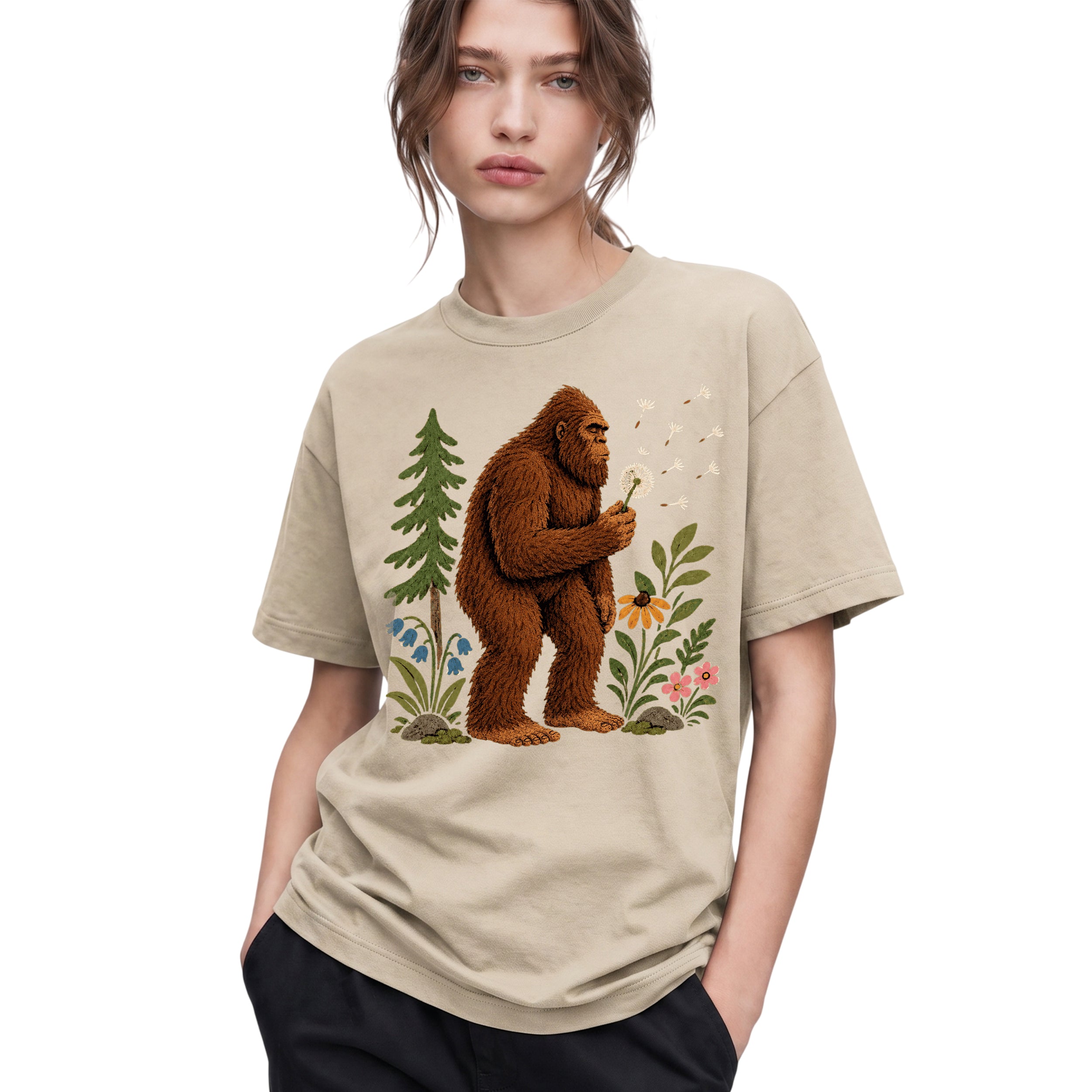 SF_COLOR=sand; SF_ITEM=adult-t-shirt; SF_ROLE=gallery; Funny Bigfoot Blowing A Dandelion T-Shirt Retro Floral Sasquatch Outdoors Tee - Sand Adult T-Shirt product image