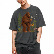 SF_COLOR=dark-heather; SF_ITEM=adult-t-shirt; SF_ROLE=gallery; Funny Bigfoot Blowing A Dandelion T-Shirt Retro Floral Sasquatch Outdoors Tee - Dark Heather Adult T-Shirt product image