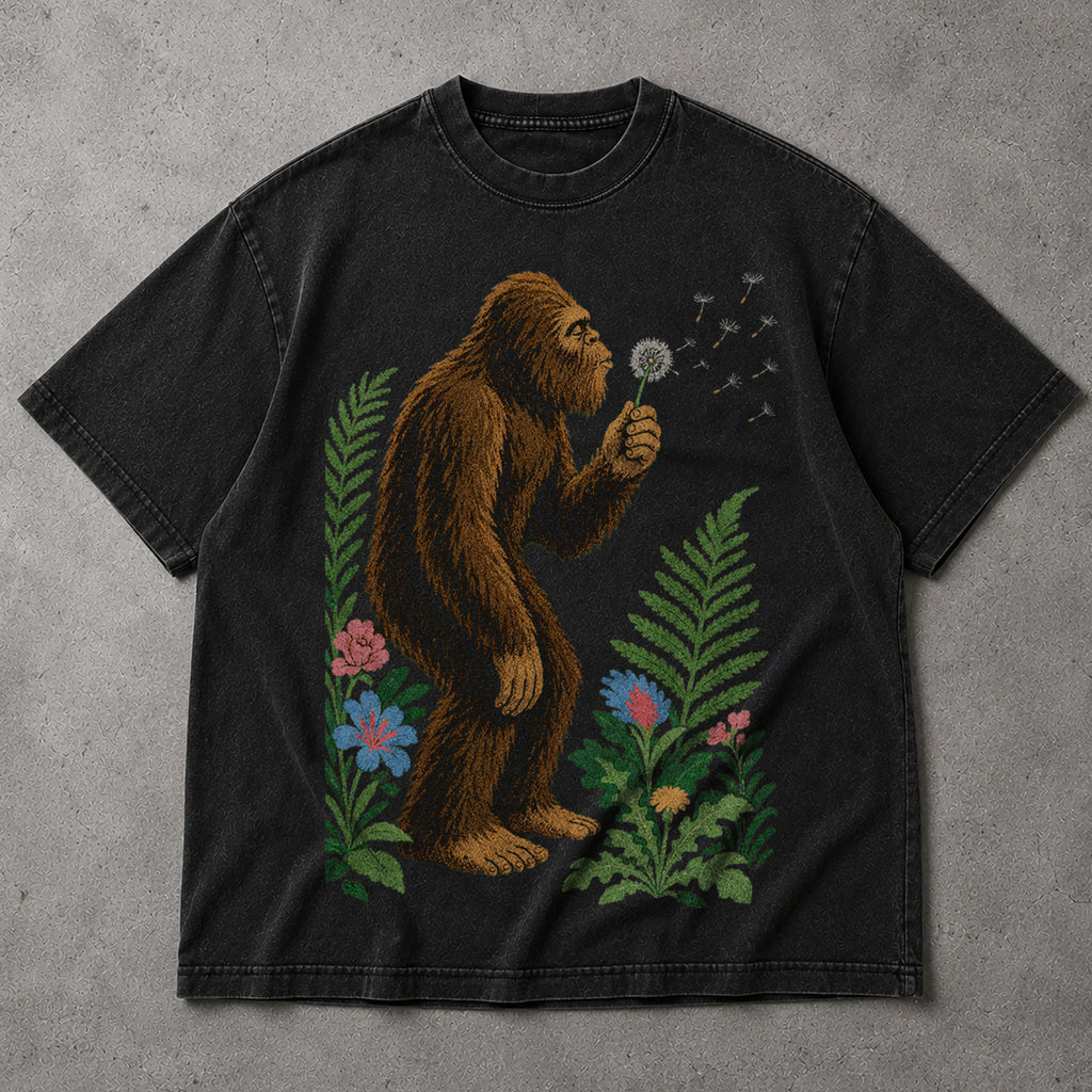 SF_COLOR=black; SF_ITEM=adult-t-shirt; SF_ROLE=main; Retro Bigfoot Blowing A Dandelion T-Shirt Vintage Sasquatch Floral Nature Tee - Black Adult T-Shirt product image