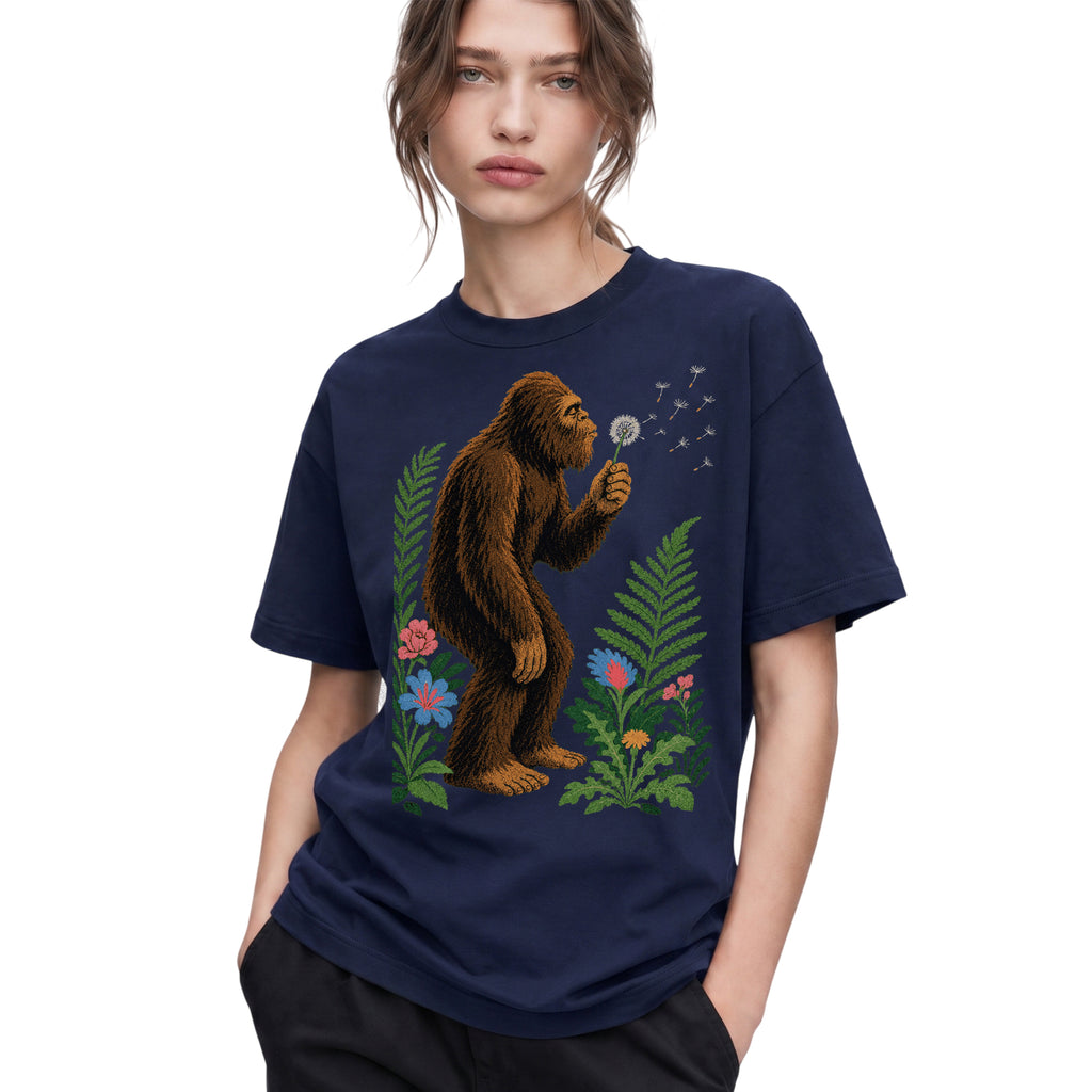 SF_COLOR=navy; SF_ITEM=adult-t-shirt; SF_ROLE=gallery; Retro Bigfoot Blowing A Dandelion T-Shirt Vintage Sasquatch Floral Nature Tee - Navy Adult T-Shirt product image