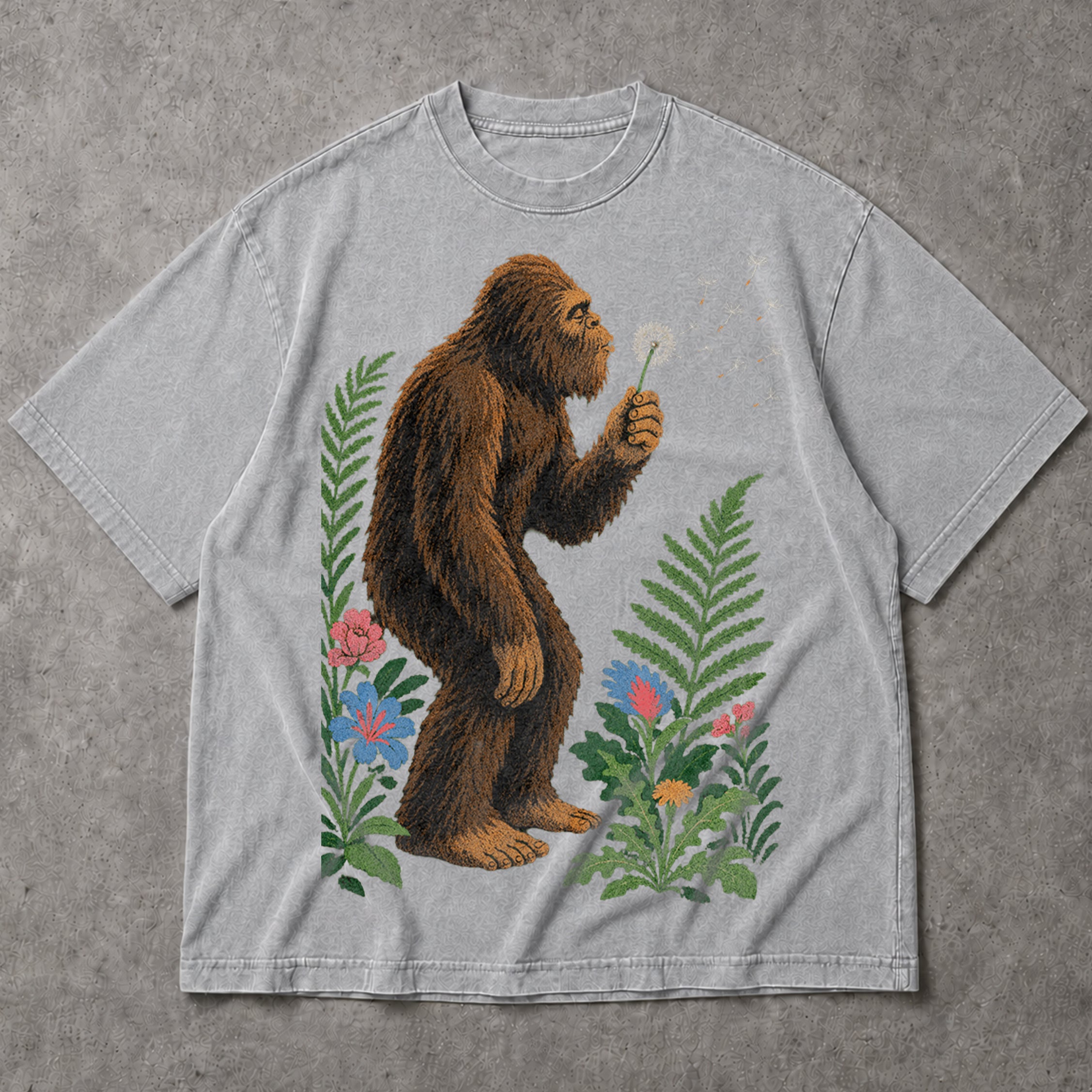 SF_COLOR=sport-grey; SF_ITEM=adult-t-shirt; SF_ROLE=main; Retro Bigfoot Blowing A Dandelion T-Shirt Vintage Sasquatch Floral Nature Tee - Sport Grey Adult T-Shirt product image