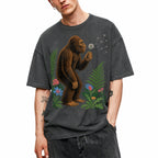 SF_COLOR=dark-heather; SF_ITEM=adult-t-shirt; SF_ROLE=gallery; Retro Bigfoot Blowing A Dandelion T-Shirt Vintage Sasquatch Floral Nature Tee - Dark Heather Adult T-Shirt product image