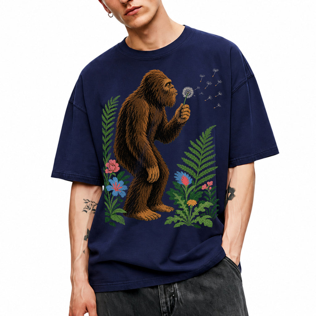 SF_COLOR=navy; SF_ITEM=adult-t-shirt; SF_ROLE=gallery; Retro Bigfoot Blowing A Dandelion T-Shirt Vintage Sasquatch Floral Nature Tee - Navy Adult T-Shirt product image