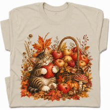 SF_COLOR=sand; SF_ITEM=adult-t-shirt; SF_ROLE=gallery; Tabby Kitten Hugging Red Apple Basket T-Shirt Cozy Autumn Cat Harvest Tee - Sand Adult T-Shirt product image